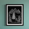 Black and white summer art print in a black frame and matting . Hanging on a teal wall.