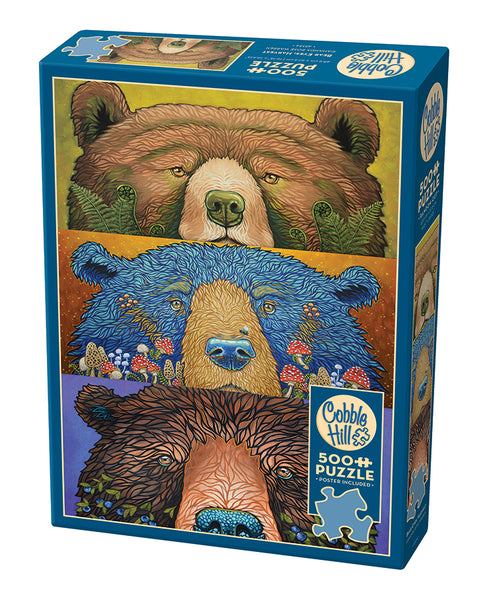 Cobble Hill puzzle blue box with three bear illustrations, each having a touch of nature to them from mushrooms to blueberries on a white background