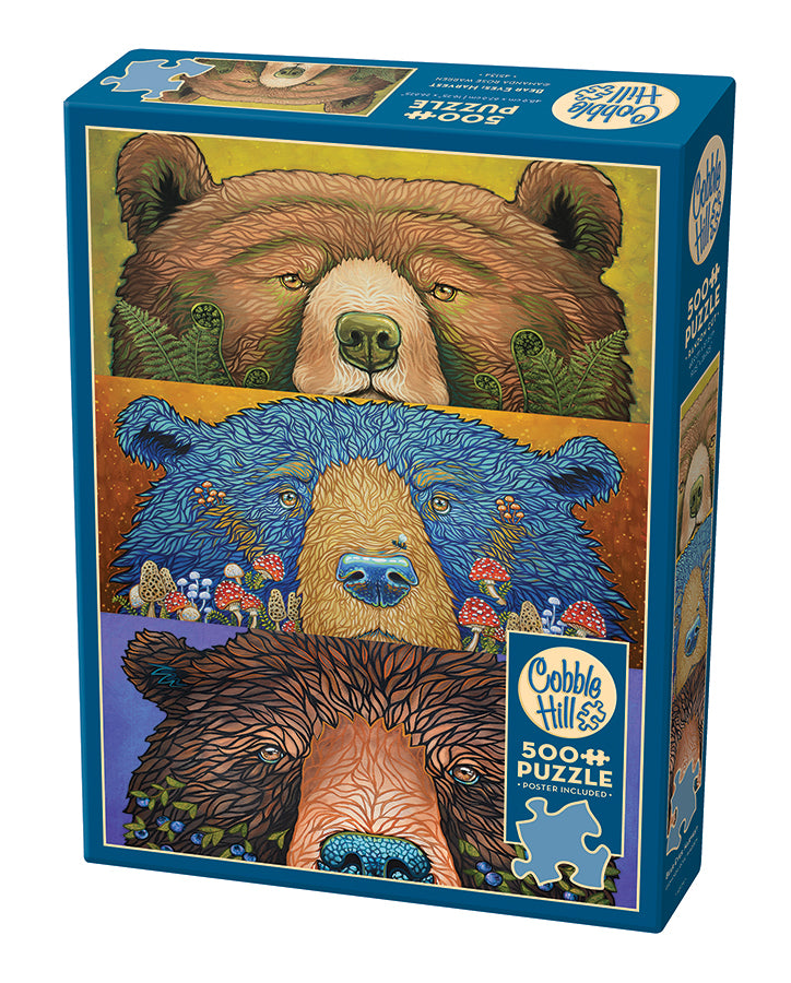 Cobble Hill puzzle blue box with three bear illustrations, each having a touch of nature to them from mushrooms to blueberries on a white background