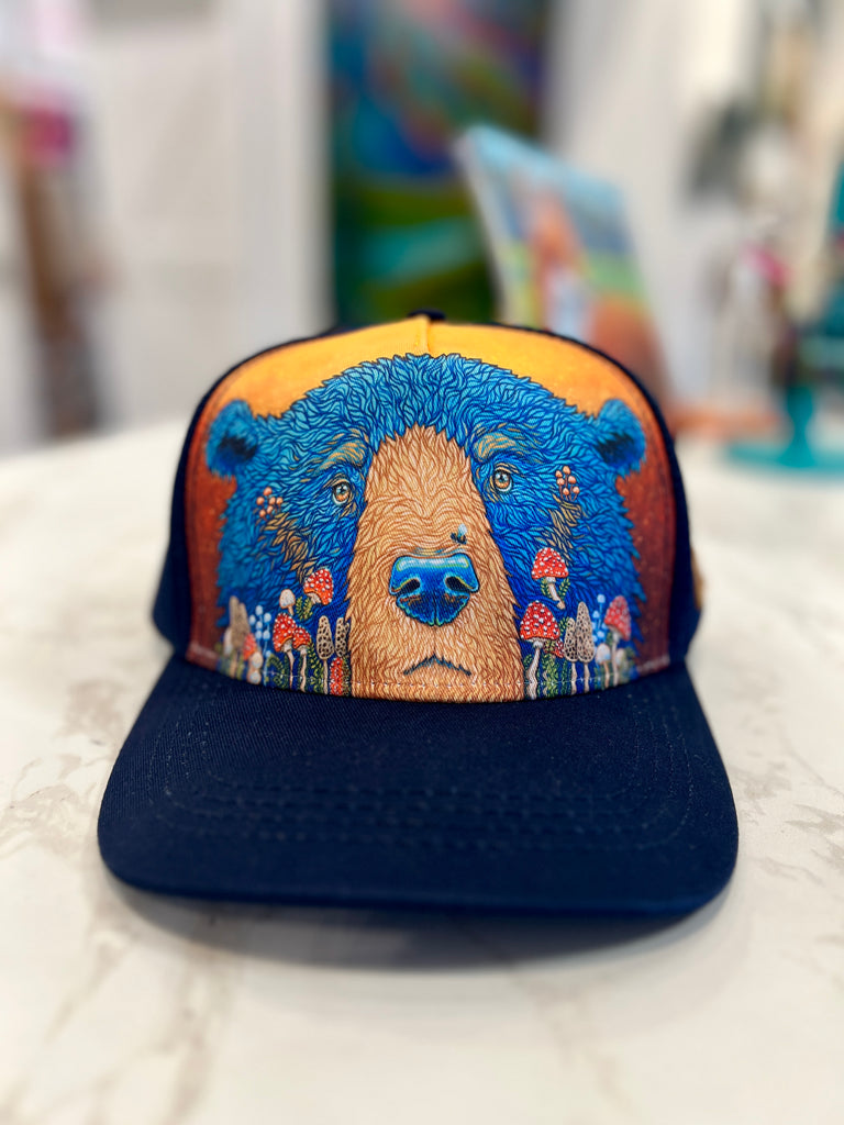 Navy Trucker hat with blue fungi bear design on a white surface, full color print 