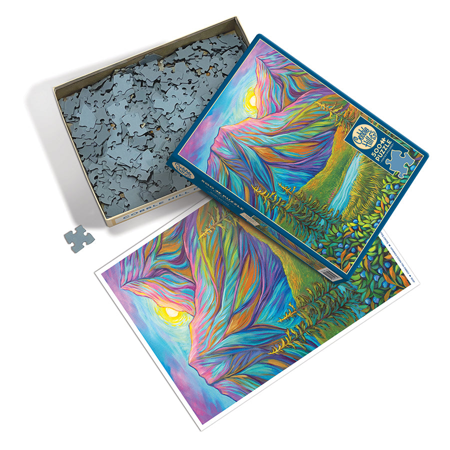 Colorful puzzle with a box opened to see size of pieces laying out on a white table