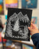 Small print of B&W Spring Equinox being held in someones hand