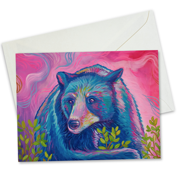 Painted blue and purple bear in a bush of leaves with a pink background and white envelope