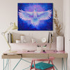 White raven artwork hanging above a pink desk in work space area