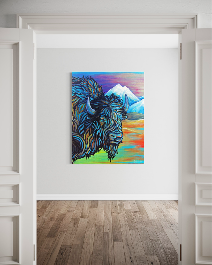 Colorful painting of a bison with mountains on a white wall.