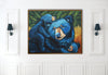 Framed painting of three blue bears on a white wall.