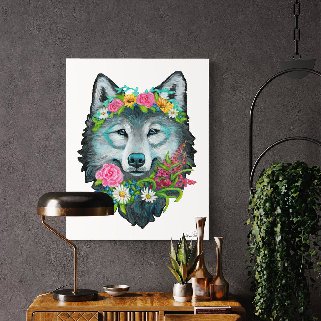 Framed artwork of a wolf with floral crown on a wall above a wooden console table.