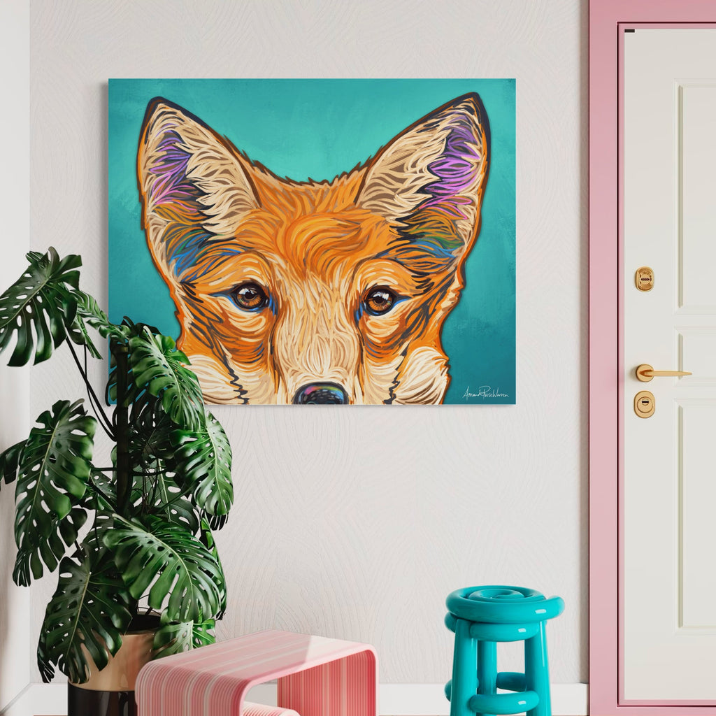 Colorful fox painting on a wall with a plant and chair in the foreground.