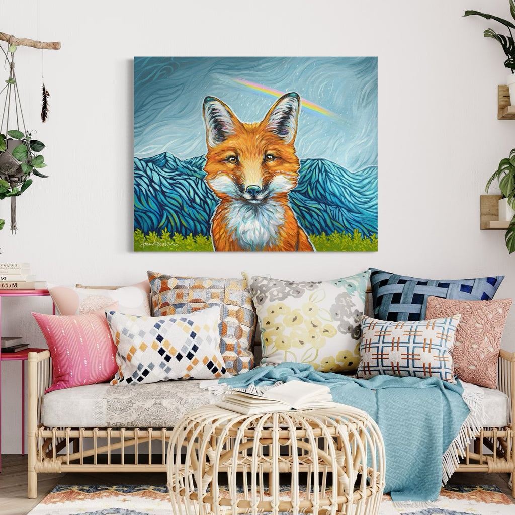 Living room with a fox painting on the wall above a sofa with colorful pillows.
