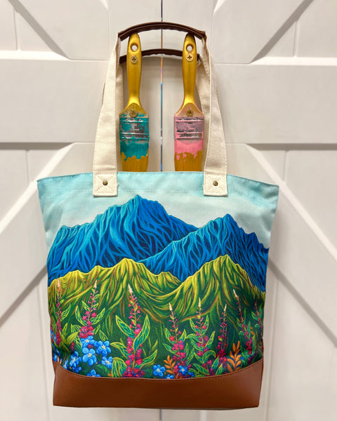 Lovely Meadow canvas tote bag with leather accents and zipper, featuring Alaska wildflowers including fireweed and forget-me-nots