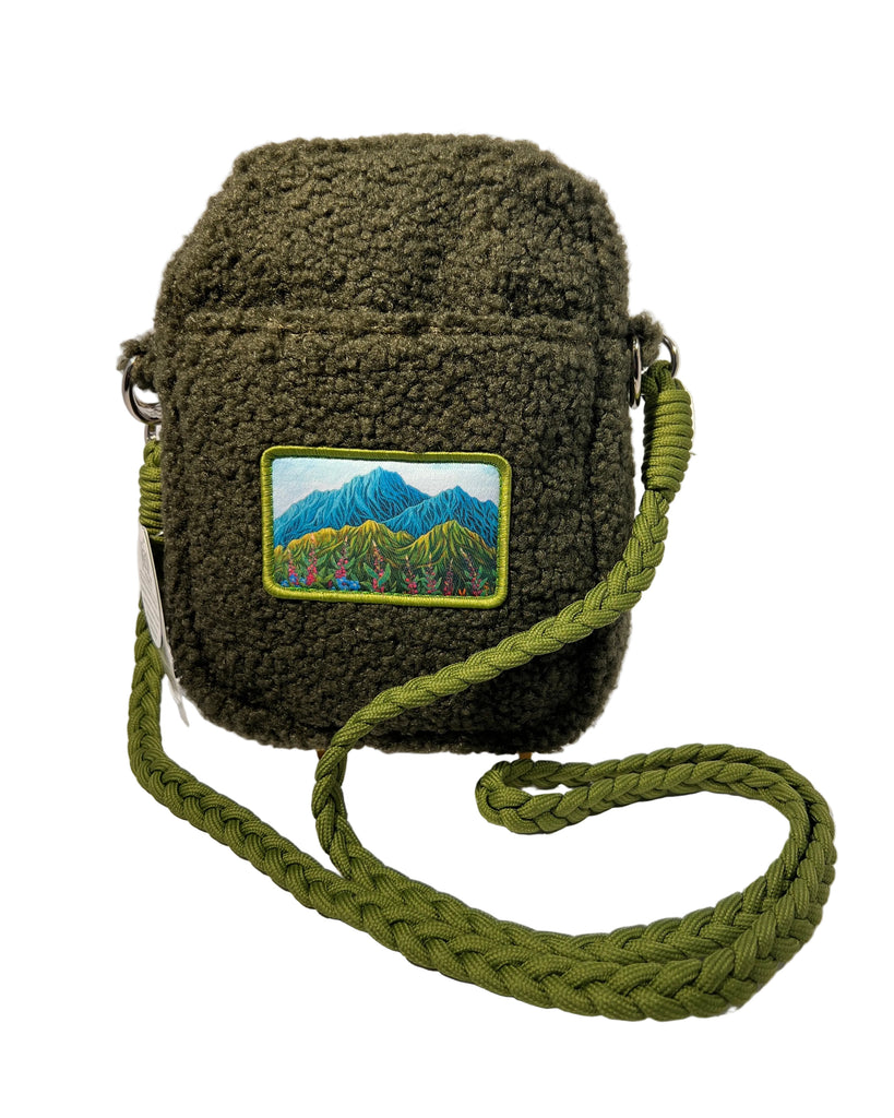 Lovely Meadow dark green Sherpa crossbody bag featuring Alaska wildflower design, soft cozy bag with fireweed and forget-me-not inspired artwork