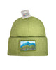 Lovely Meadow ribbed green beanie featuring Alaska wildflowers, including fireweed and forget-me-nots in a soft nature-inspired design