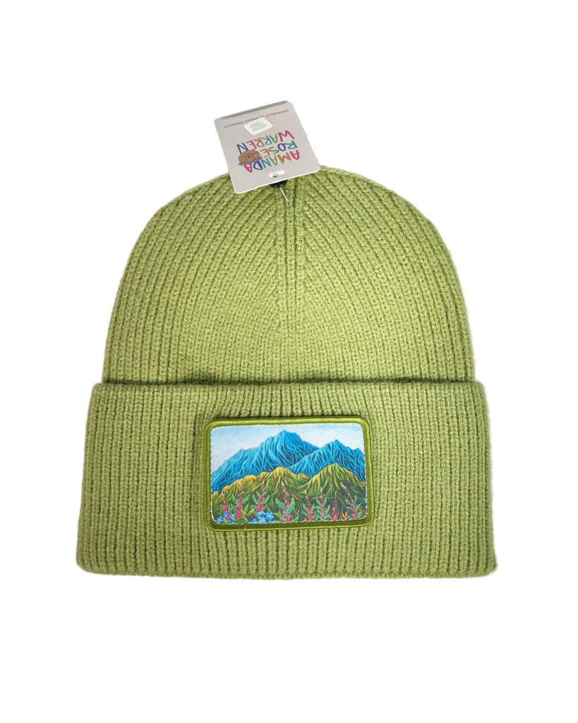 Lovely Meadow ribbed green beanie featuring Alaska wildflowers, including fireweed and forget-me-nots in a soft nature-inspired design
