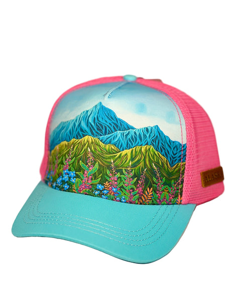 Lovely Meadow trucker hat featuring Alaska wildflower design with fireweed and forget-me-nots, adjustable mesh cap with soft floral artwork