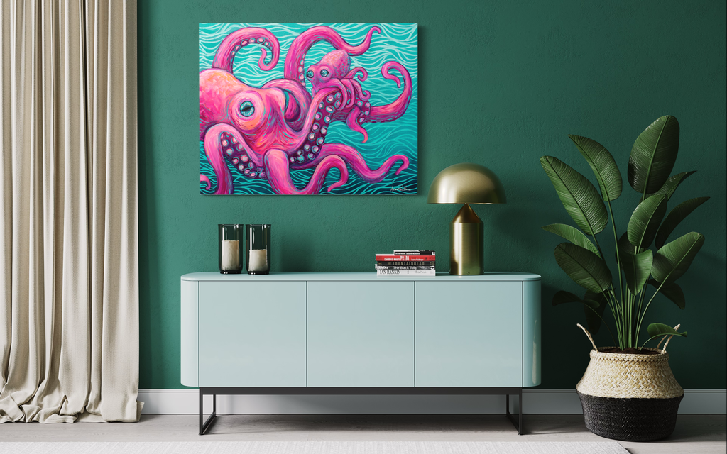 Colorful octopus family artwork on a green wall above a light blue cabinet with decorative items.