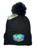 Mystic Trees fleece lined pom beanie featuring Alaska forest design with colorful rainbow trees, cozy winter knit hat