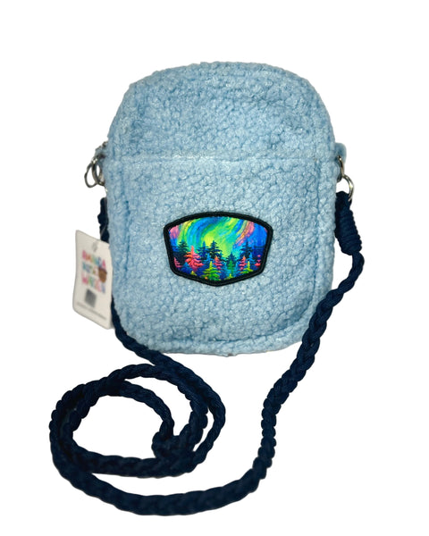 Mystic Trees light blue Sherpa crossbody bag featuring Alaska-inspired rainbow forest design with soft cozy texture