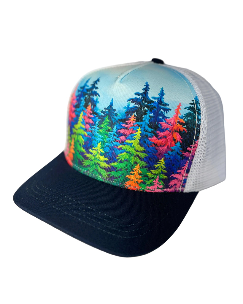 Mystic Trees navy trucker hat featuring Alaska-inspired rainbow forest design, adjustable mesh cap with vibrant artistic woodland style