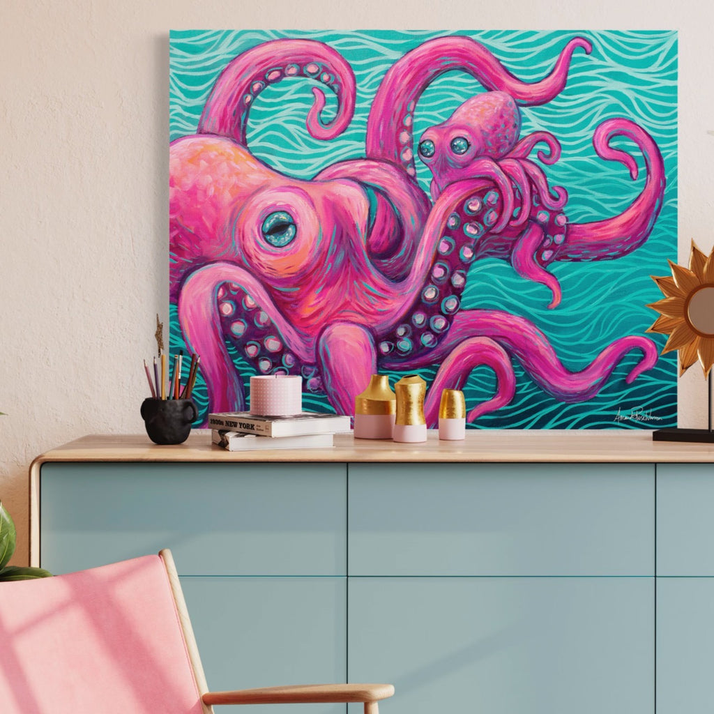 Colorful octopus painting on a wall above a light blue cabinet with decorative items.