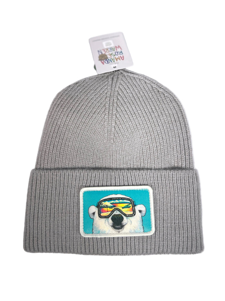 Gray beanie with a polar bear patch wearing goggles on a white background