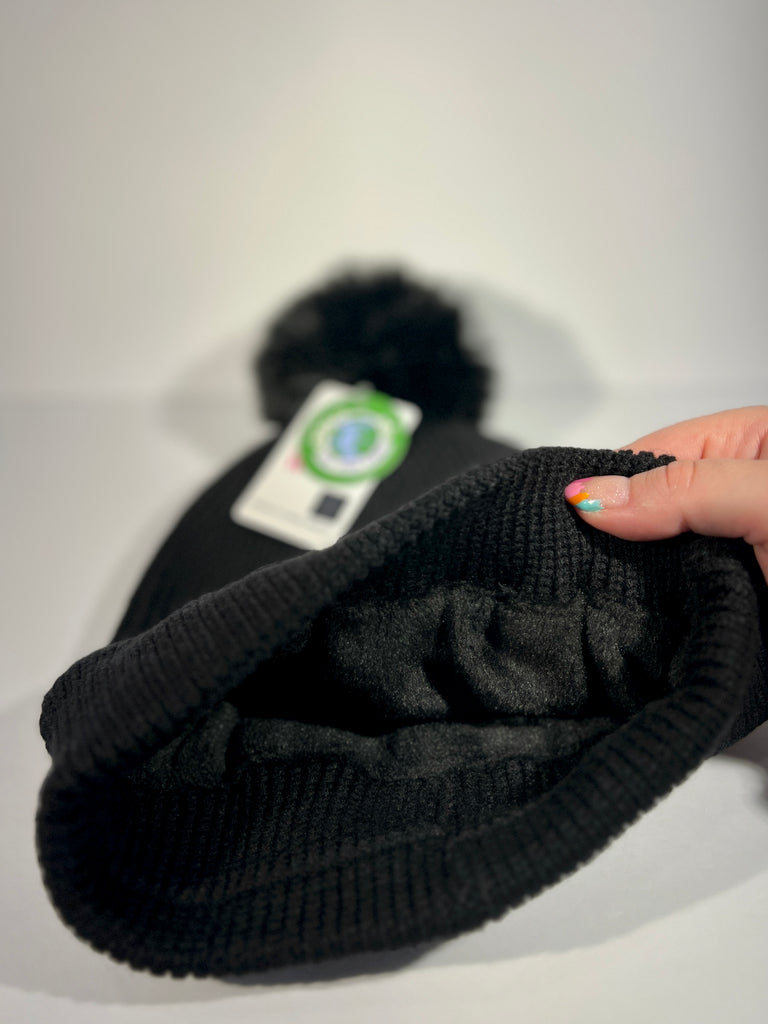 Rainbow forest pom beanie inspired by Alaska, Mystic Trees design with colorful whimsical woodland artwork and soft fleece lining