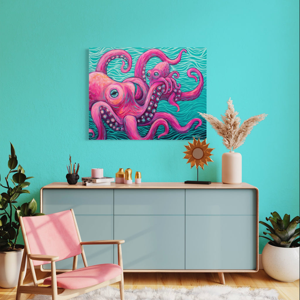 Living room with a pink octopus artwork on a teal wall, pink chair, and decorative items.