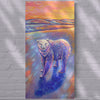 Colorful painting of a bear on a textured wall