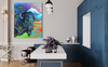Modern kitchen with blue cabinets, white countertops, and a colorful abstract painting of a bison on the wall.