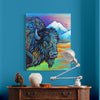Colorful painting of a bison on a blue wall above a wooden console table with decorative items.