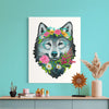 Fine art print of a wolf with floral crown on a teal wall above a wooden shelf.