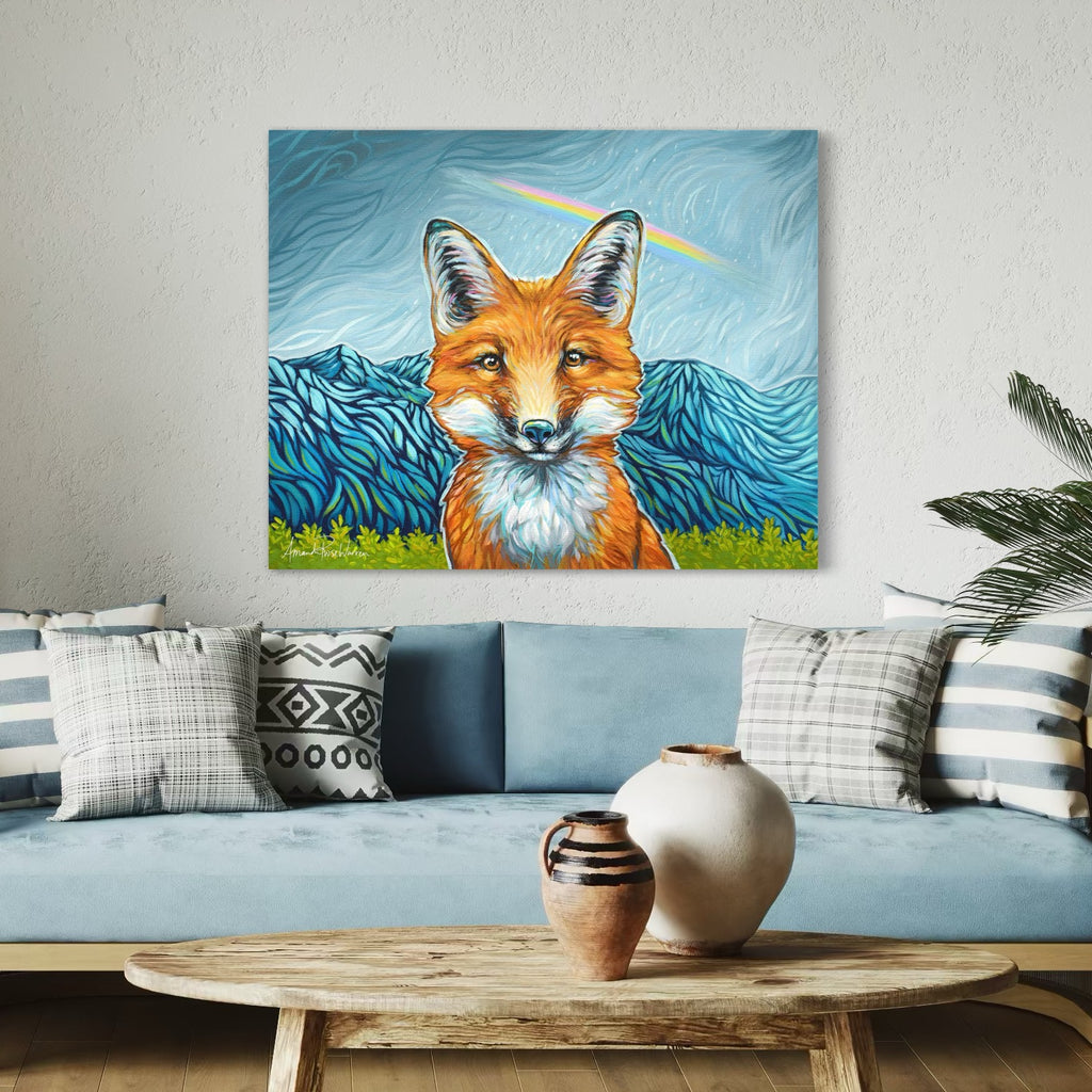 Living room with a blue sofa, decorative pillows, and a painting of a fox on the wall.