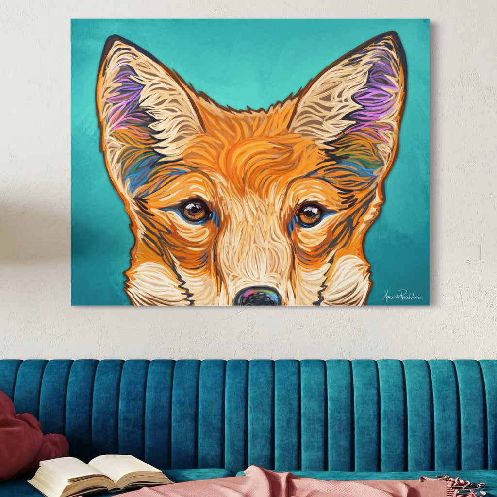 Colorful painting of a fox's face on a teal wall above a blue couch.