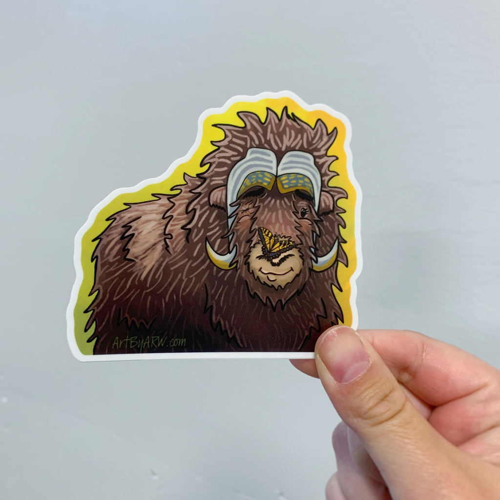 Holding Elim the musk ox with his little friend the yellow butterfly sticker