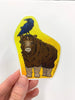 Holding the Raven sitting on the baby musk ox's head sticker