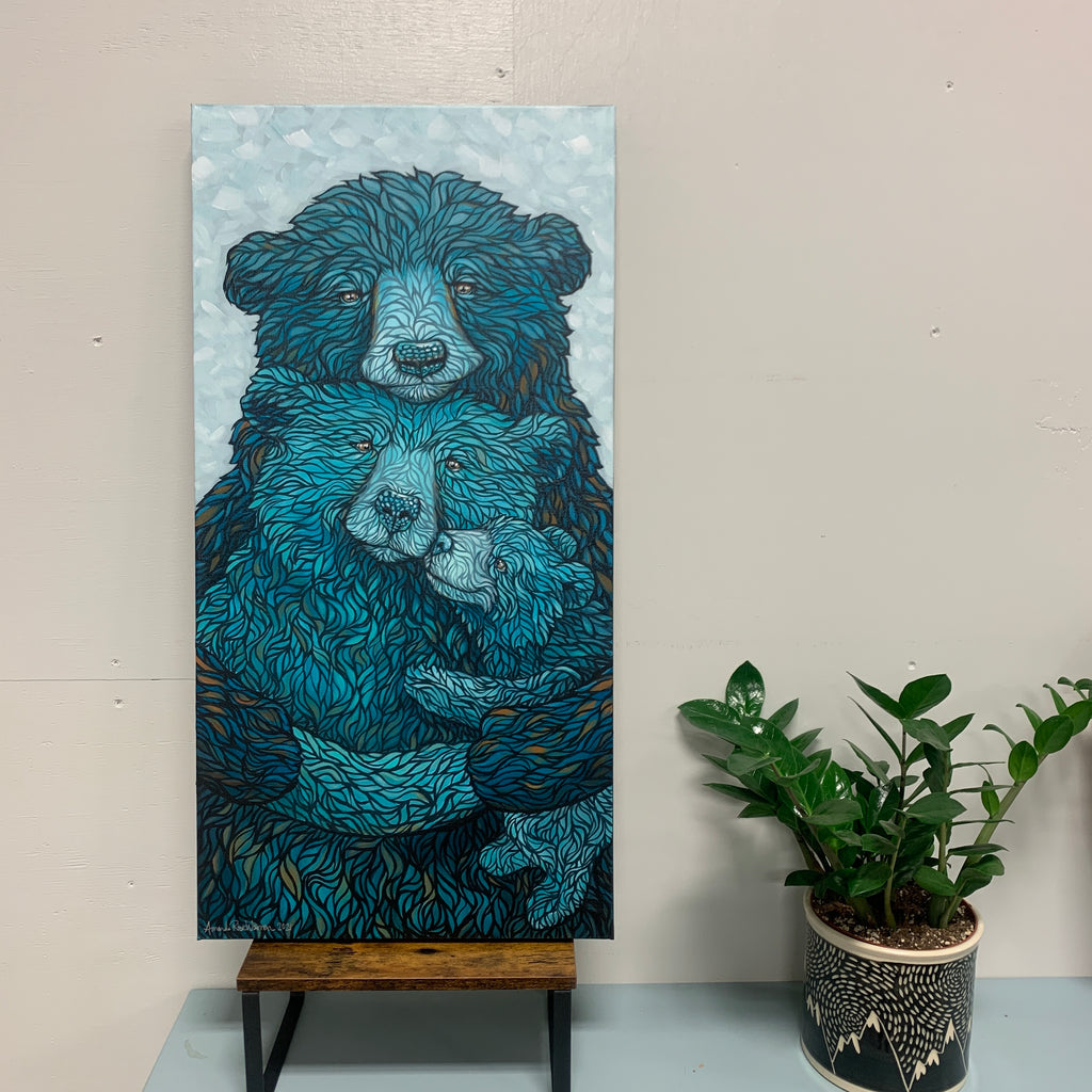 Father bear embracing momma bear and baby bear cub with a vibrant blue and hints of golden brown fur and light blue background 