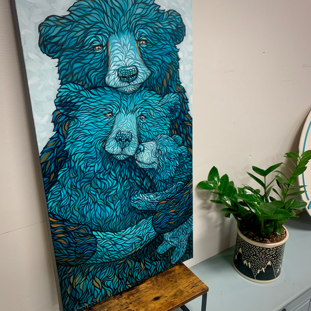 Father bear embracing momma bear and baby bear cub with a vibrant blue and hints of golden brown fur and light blue background 